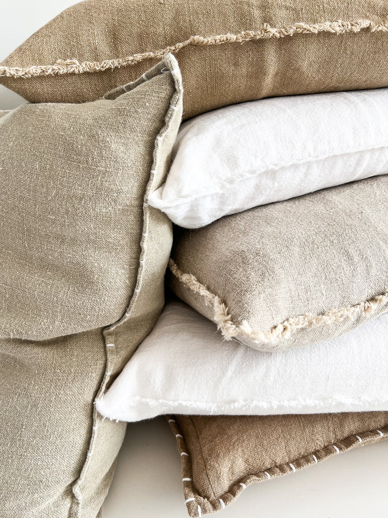 ushion covers available in a raw fringe edge or embroidered. Pure quality linen in natural earthy colours with a rustic stonewash finish. 50cm throwrug also available