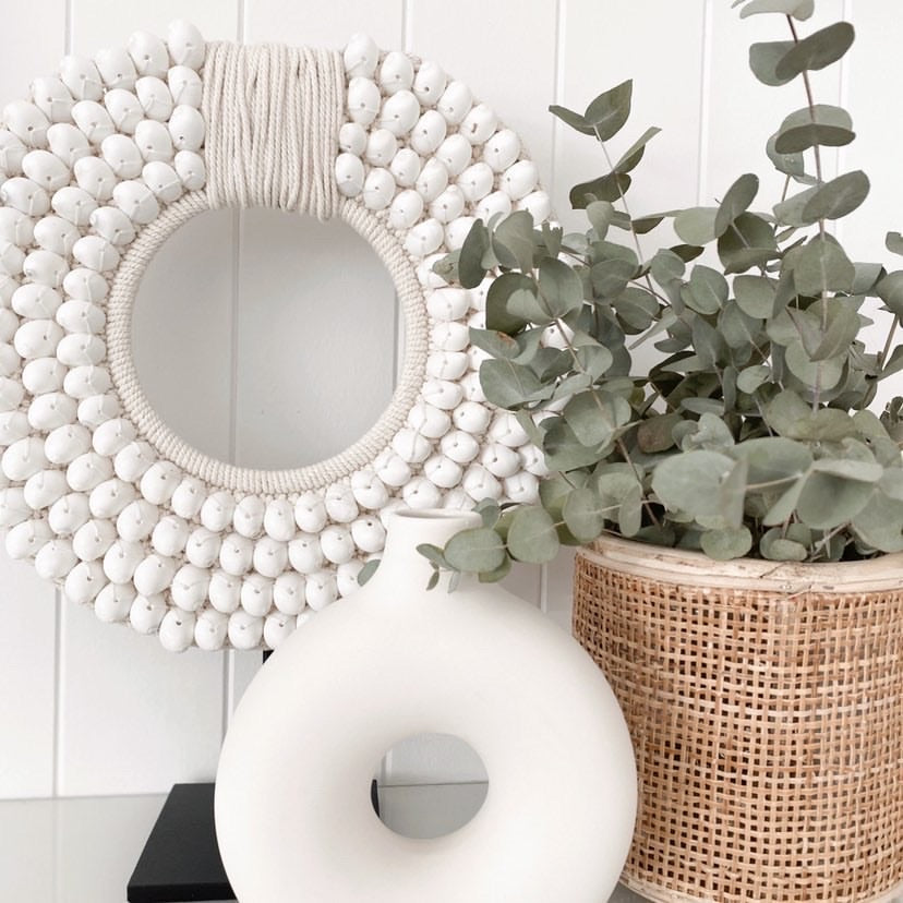 Embellished with crisp white moon shells, intricately sewn onto a thick crochet backing, Our Koko designs are a gorgeous versatile feature made to suit any modern space & inject a coastal vibe.  White Coastal Decor, Papua Shell Tribal Necklace, standing decor, coastal white modern decor. Homewares Melbourne. Sale Now On