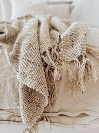 The Mayla Linen/Cotton throwrug by Eadie Lifestyle oozes comfort and warmth with its divine tactility. A welcome addition to our much loved Hand Woven collection, the rustic texture is carefully crafted by artisans who weave the fabric on a traditional hand loom with love and care.   Generous in size & visually rustic, this piece is ideal for layering on a bed or sofa. Its weight and softness showcases a rich & luxurious quality. Pairs well with stonewashed linens, crisp whites & matching Mayla Cushions. 